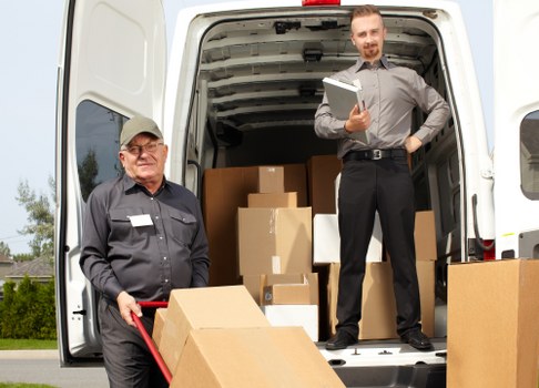Professional removal team navigating a central London residential building