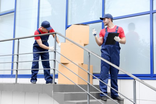 Professionals handling an apartment move in Barbican
