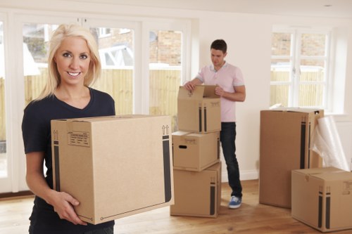 Office relocation planning in Barbican with moving boxes and business equipment