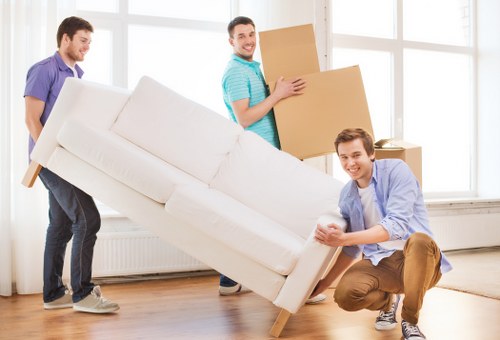 Packed furniture and cartons prepared for a Barbican removals job
