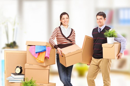 Local Barbican removals team preparing furniture protection and transport