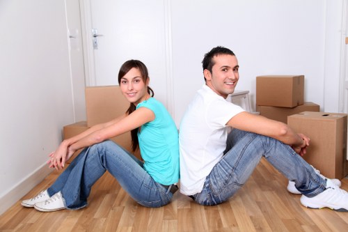 Packed moving boxes and furniture ready for transport in Barbican