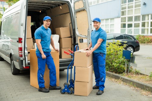 Barbican Removals specialist handling items in a modern London property