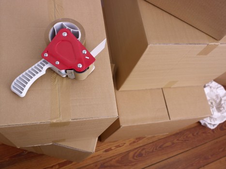Local moving team handling boxes and household items in Barbican