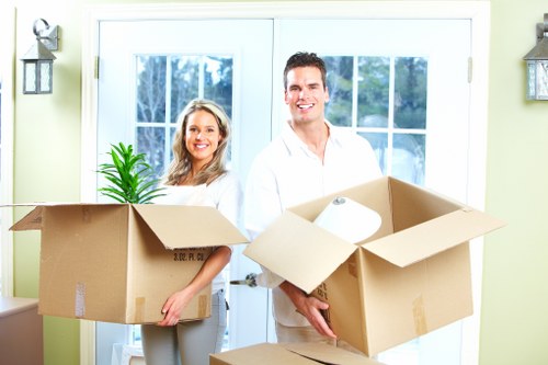 Packed household boxes and furniture ready for transport in Barbican