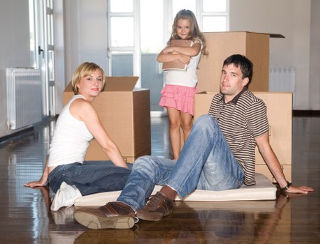 Loading boxes and furniture into a removal truck in central London